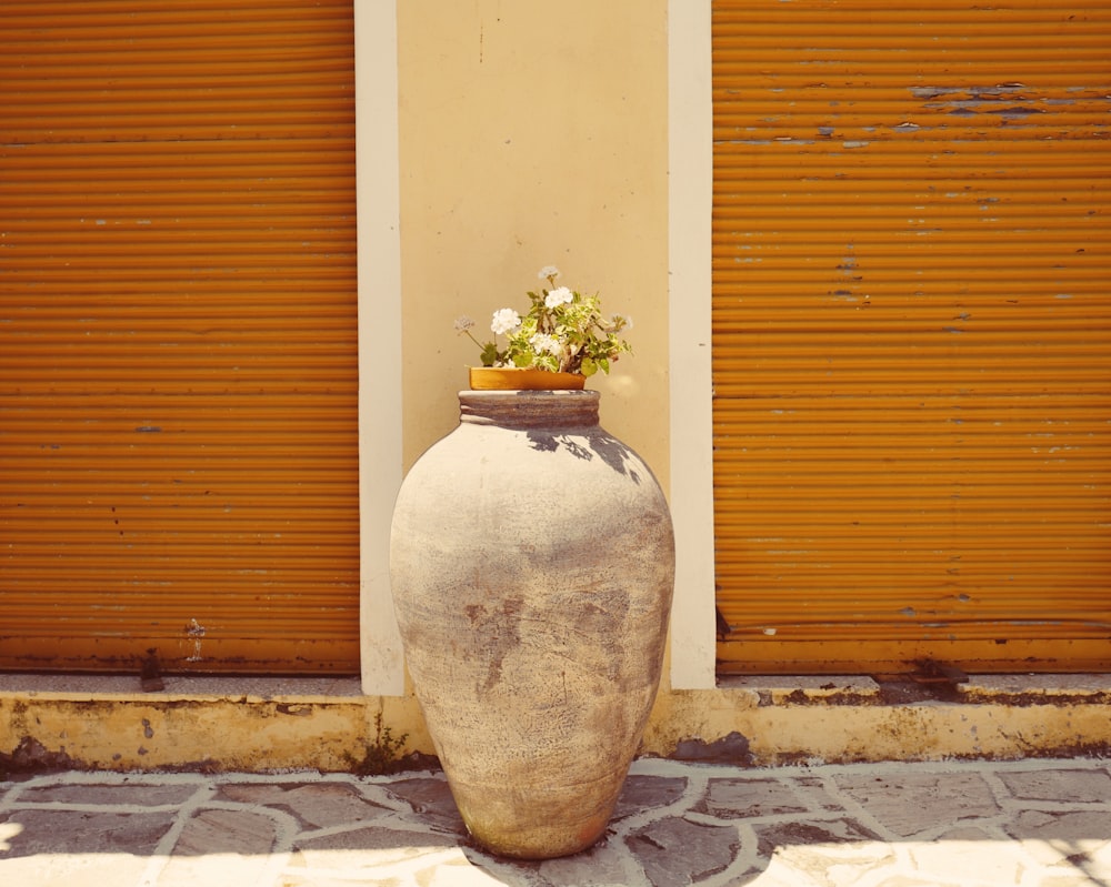 pot of flower in floor vase