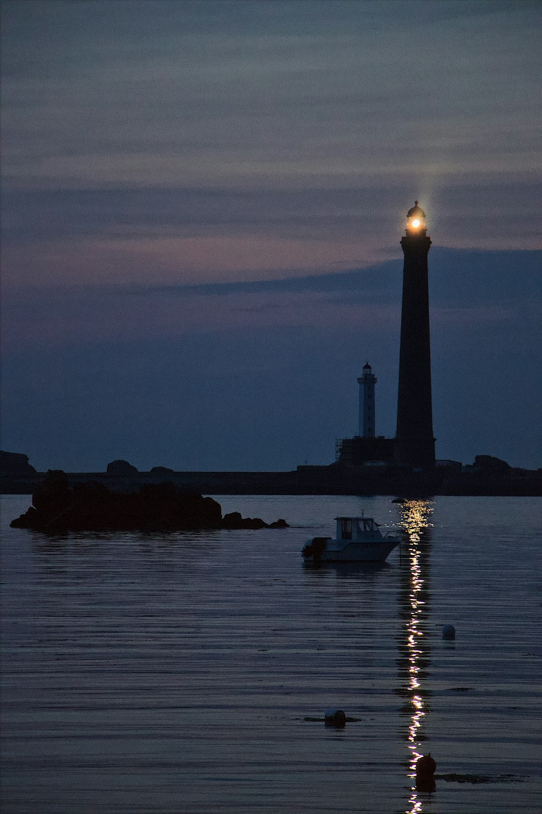 lighthouse by the sea at dusk