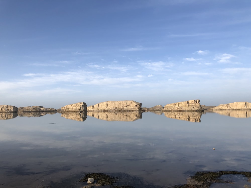 brown stones and body of water