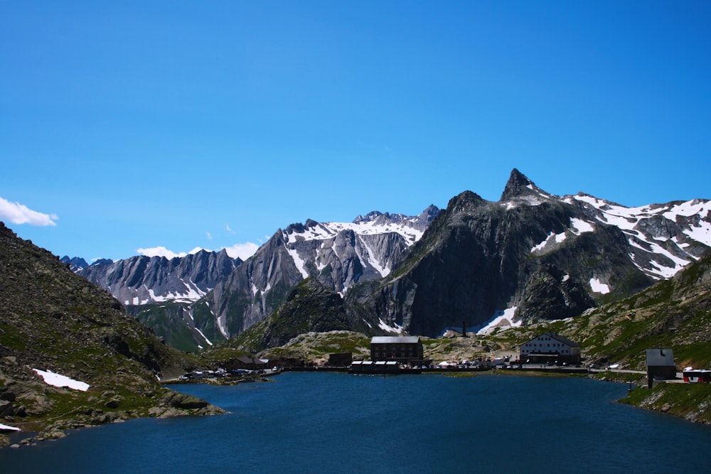 mountains and lake under blue sky