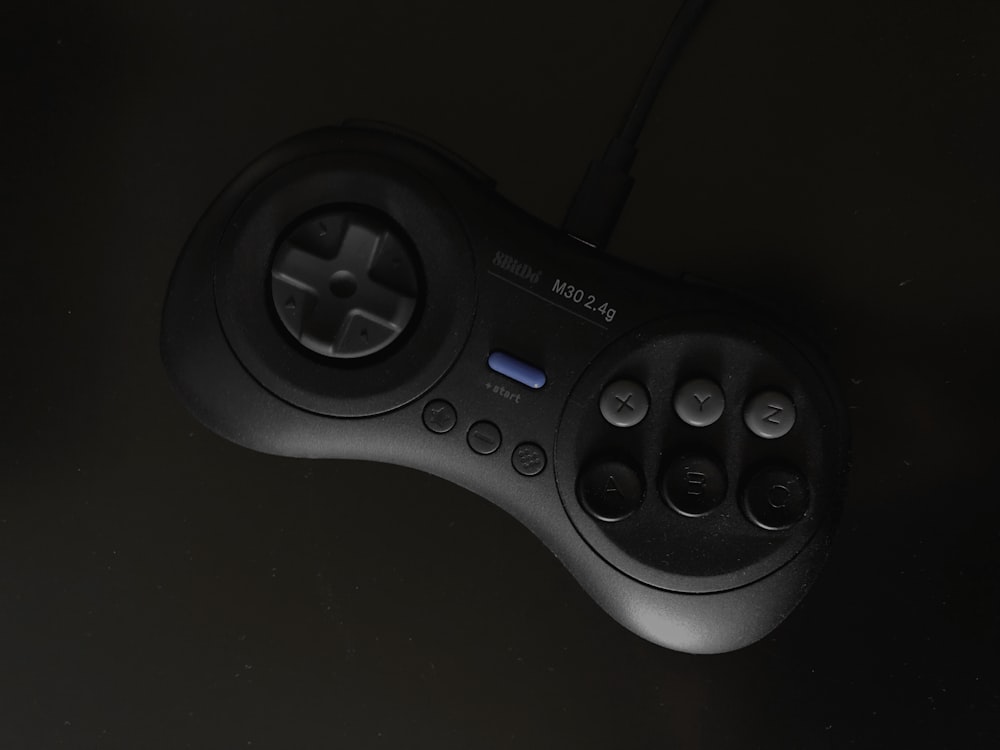 gray and black SEGA Genesis controller
