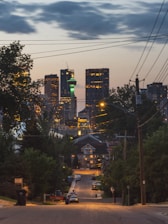 City skyline at dusk with green energy solutions integrated.