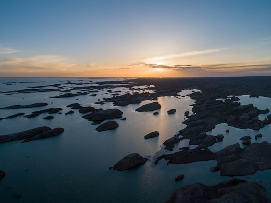 high angle photo of boulder rocks and body of water in Haixi China