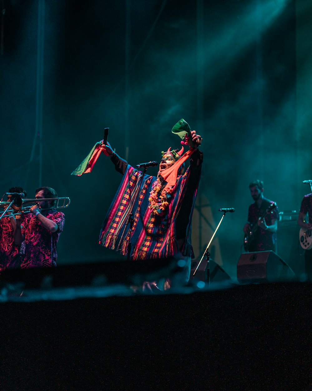 a group of people standing on top of a stage