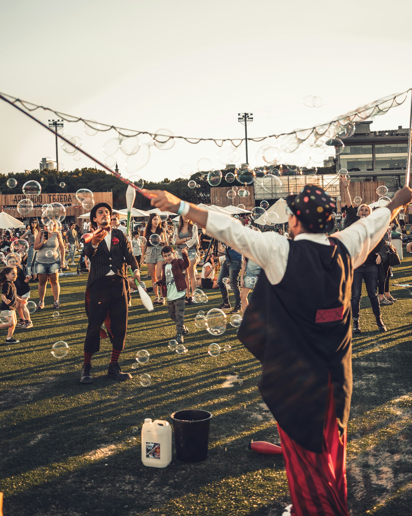 Samyang AF 35mm F2.8 FE sample photo. Man performing during daytime photography