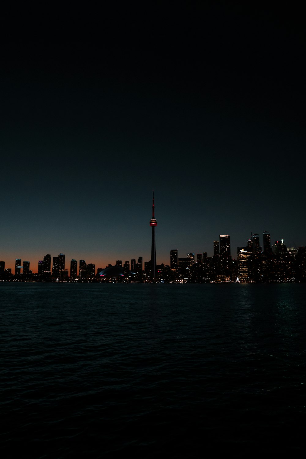 a view of a city at night from the water