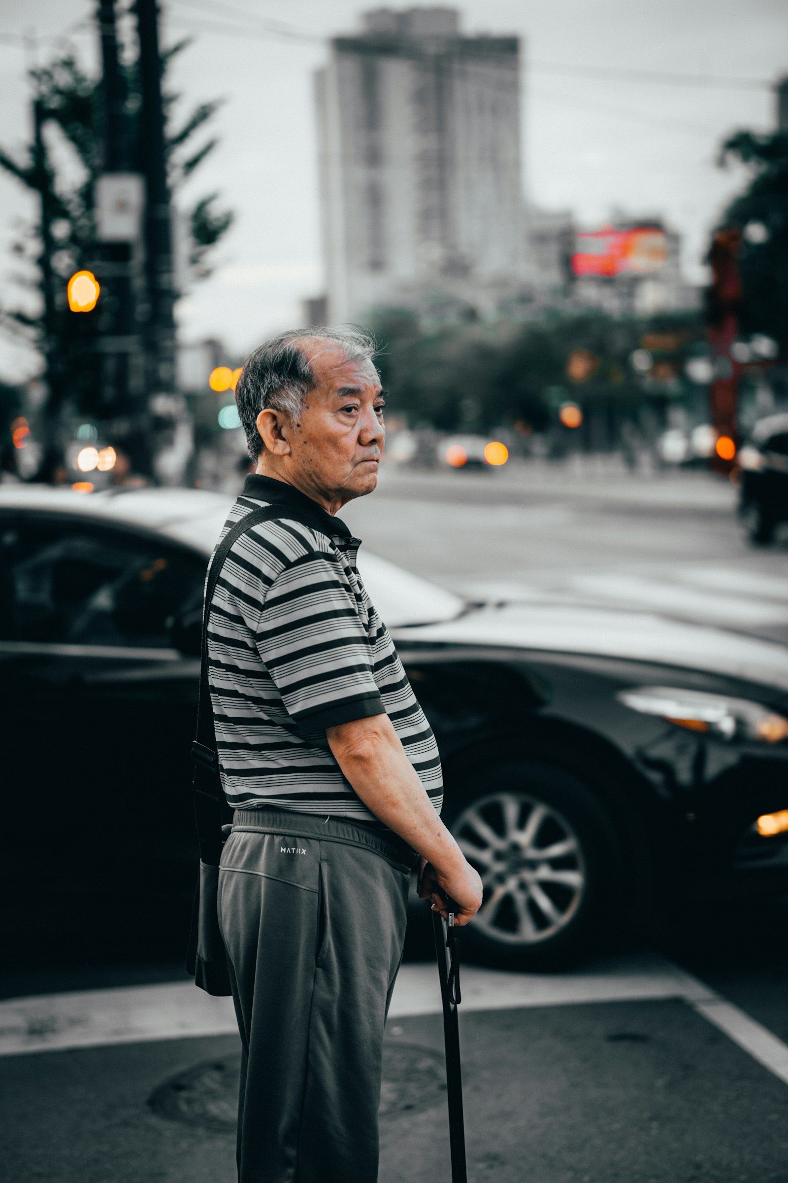 Sigma 56mm F1.4 DC DN | C sample photo. Old man using cane photography