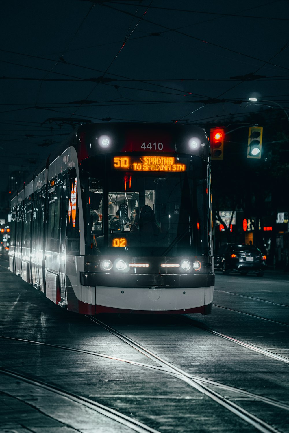 white and black bus during nighttime