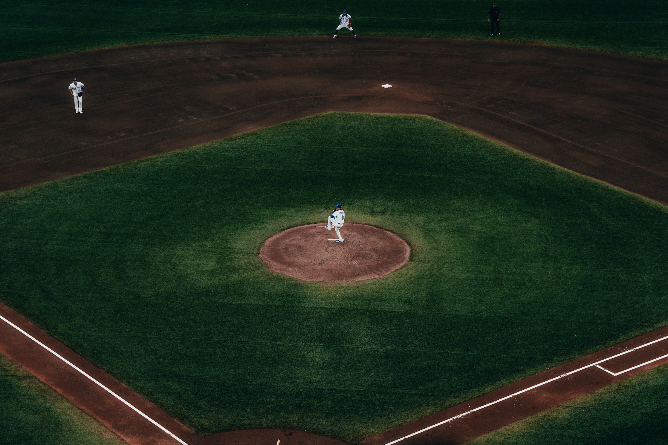 Pitcher on the mound at a baseball field