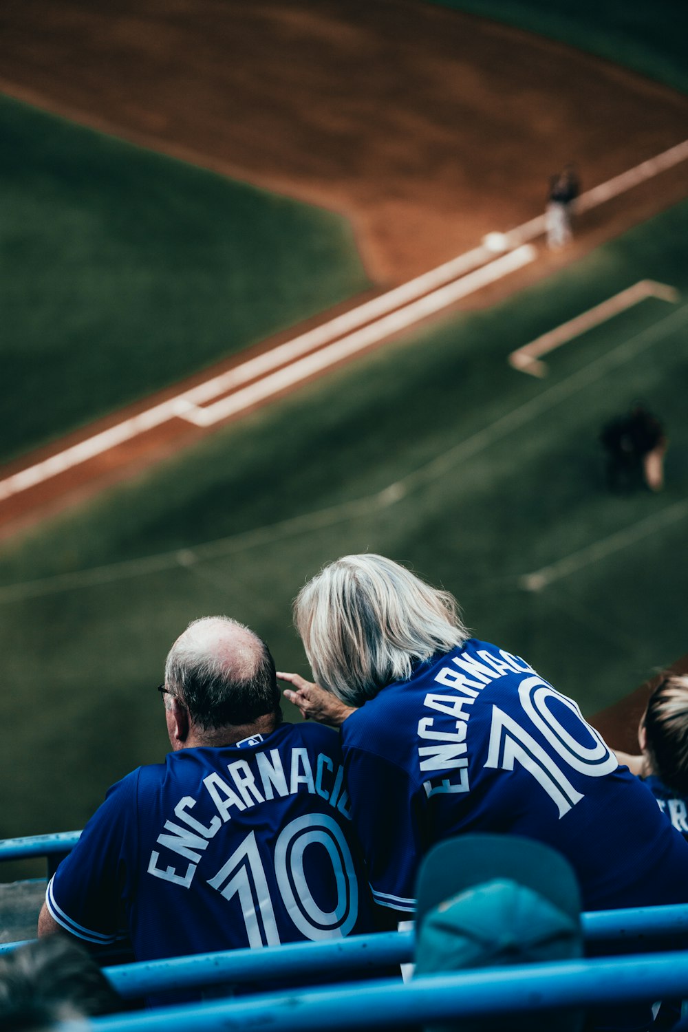 two person in a baseball field during daytime