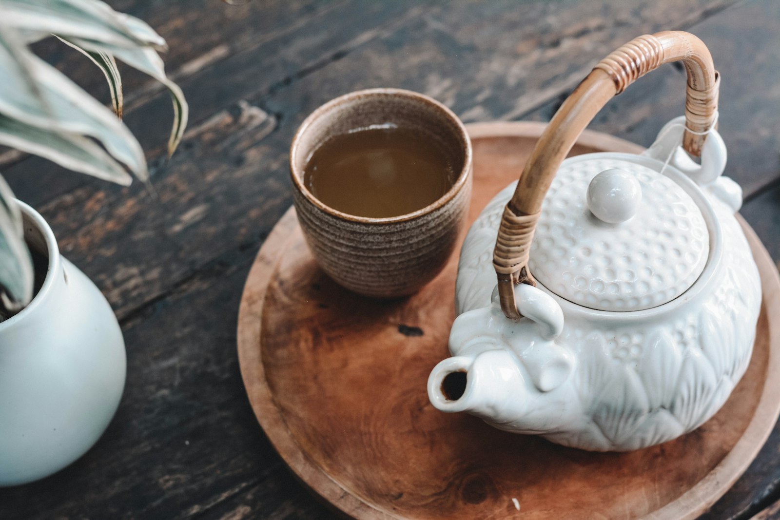 A cup of chrysanthemum tea on a wooden table, a traditional Chinese remedy for internal heat symptoms