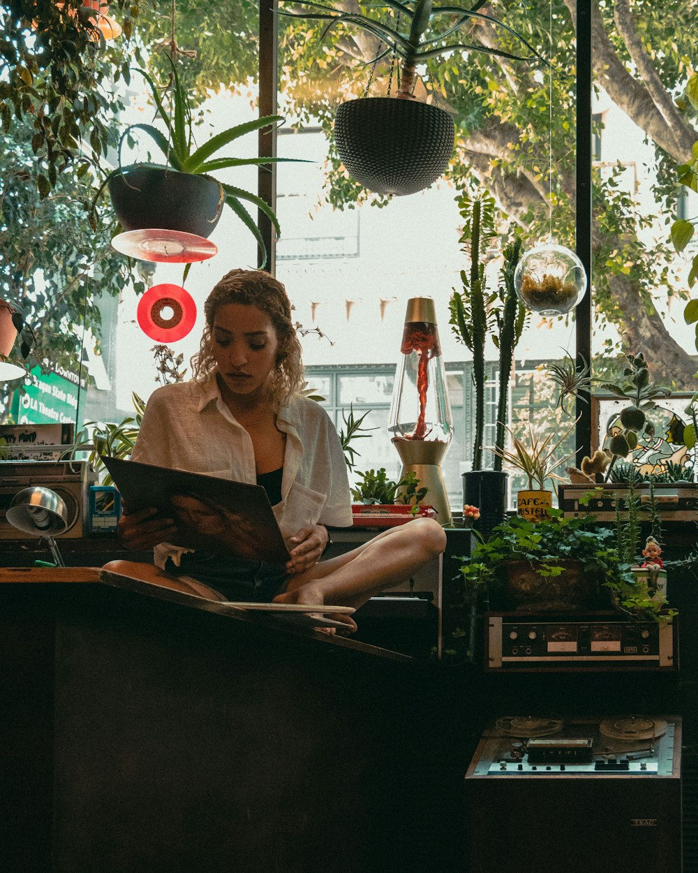 woman sitting holding poster