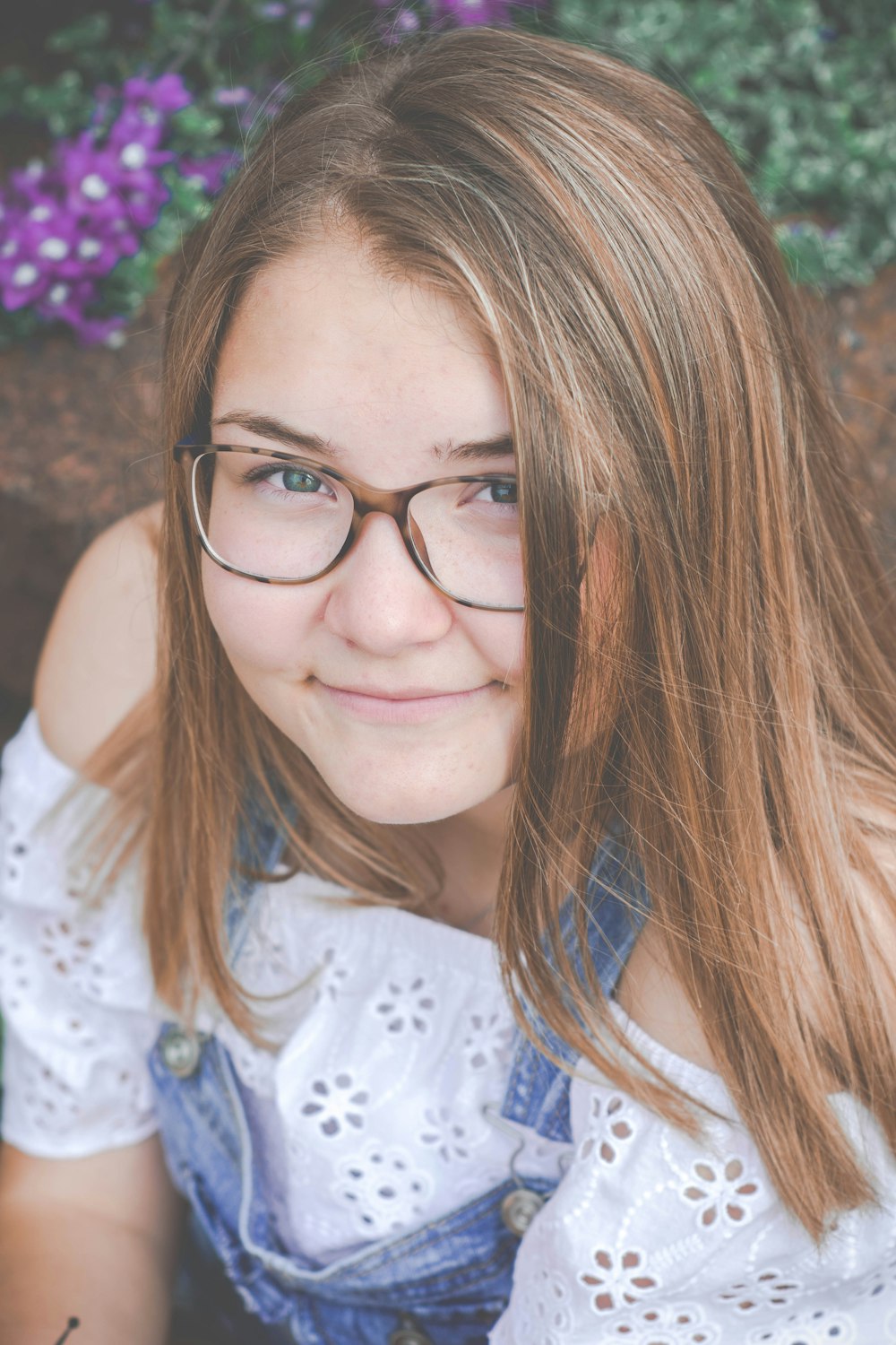 woman wearing eyeglasses smiling