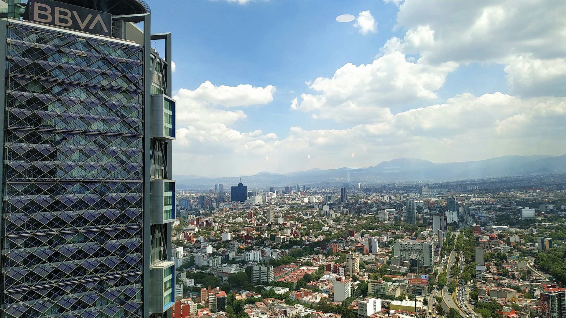 BBVA building under cloudy sky during daytime