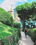 A serene view of a pesantren with students walking.