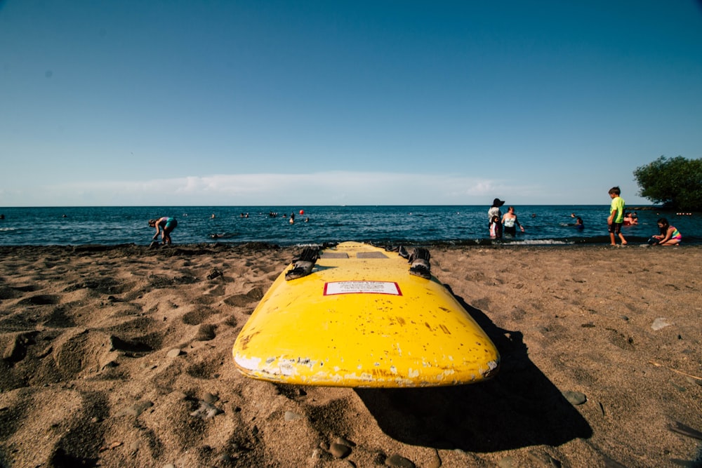 white and yellow surfboard