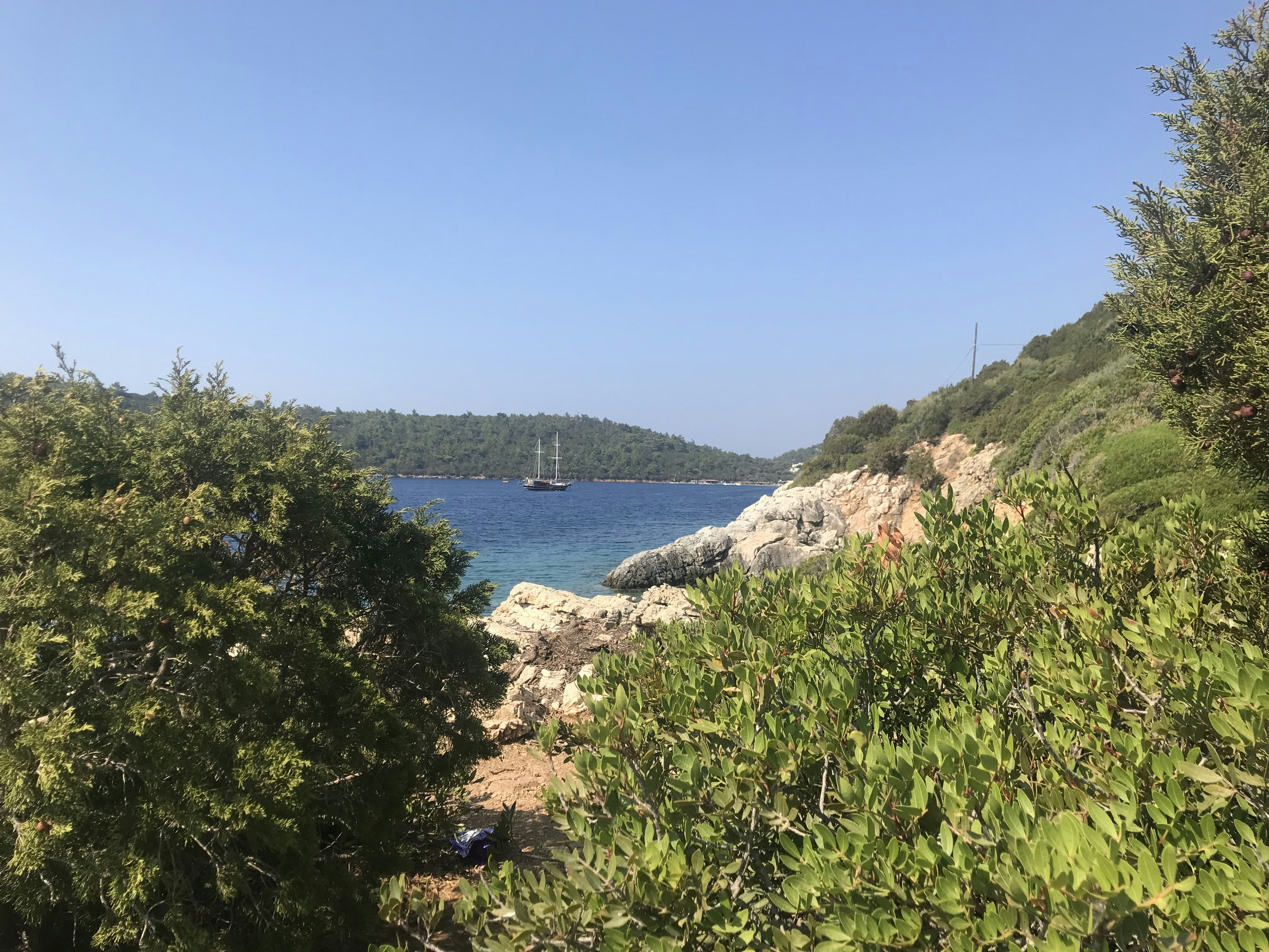 Sheltered turquoise bay surrounded by green hills on the Bodrum Peninsula