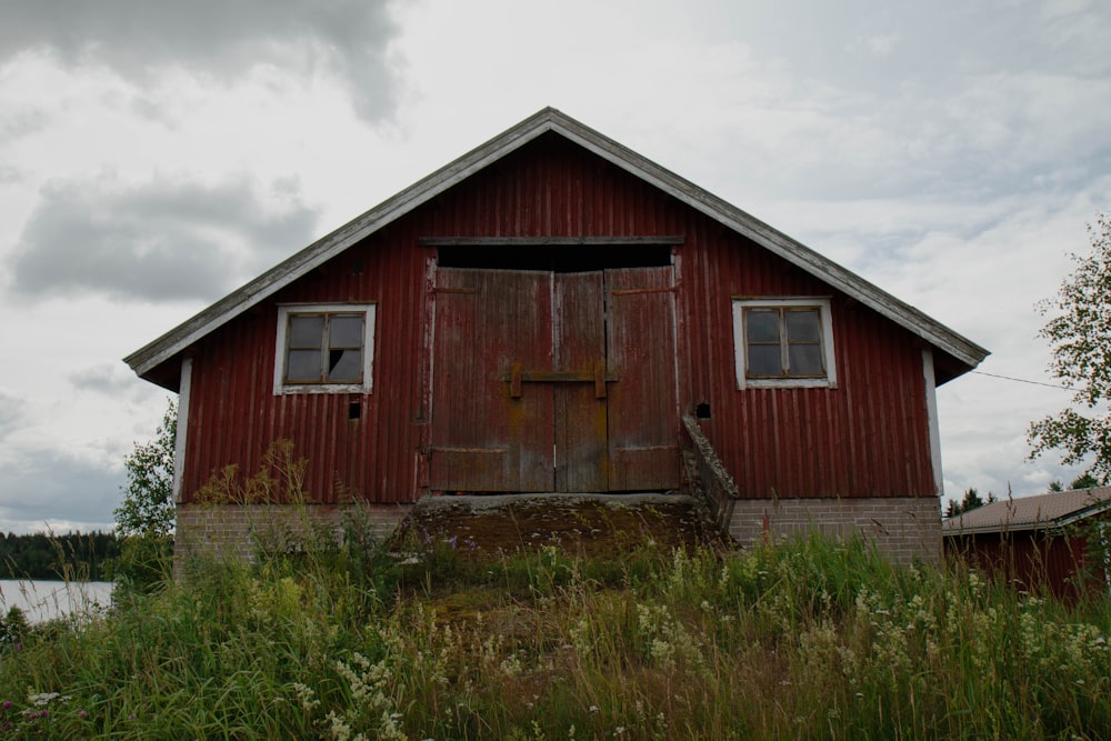 red and gray wooden house at daytime