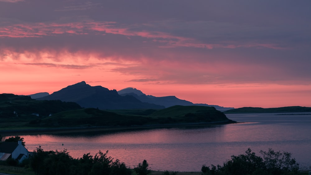 calm body of water during sunset