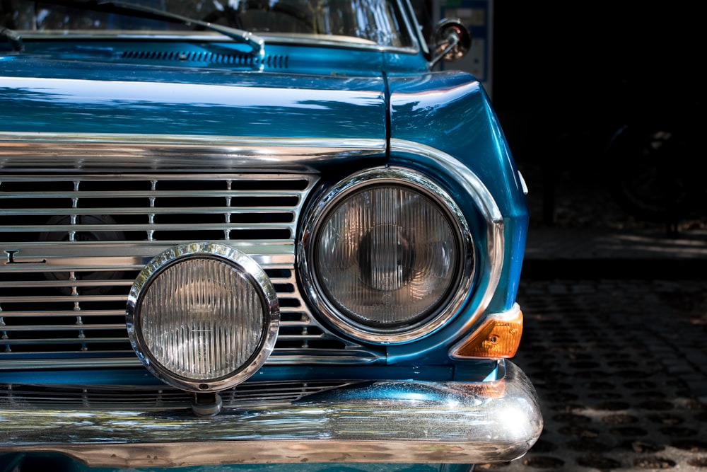 a close up of the front of a blue car