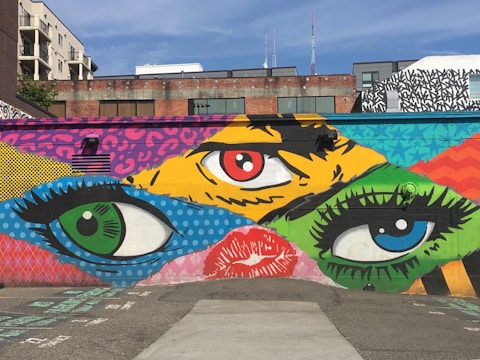 A street mural featuring an eye-catching advertisement painted on a brick wall.