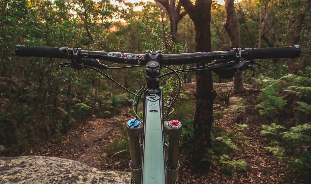 green and black bicycle close-up photography