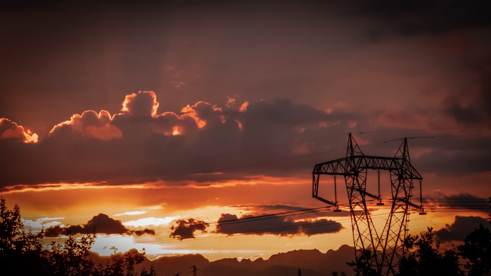 silhouette of utility post during golden hour