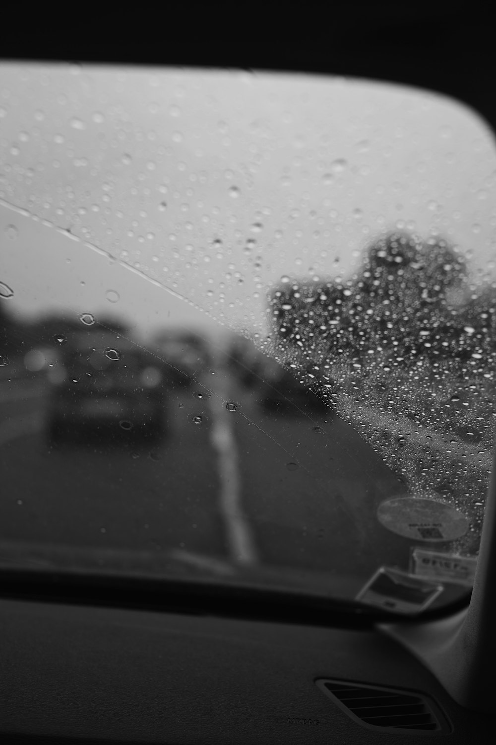 vehicle windshield with dewdrops