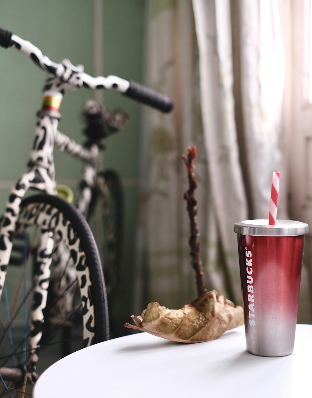 tumbler on table near bike