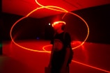 man wearing red neon eyeglasses