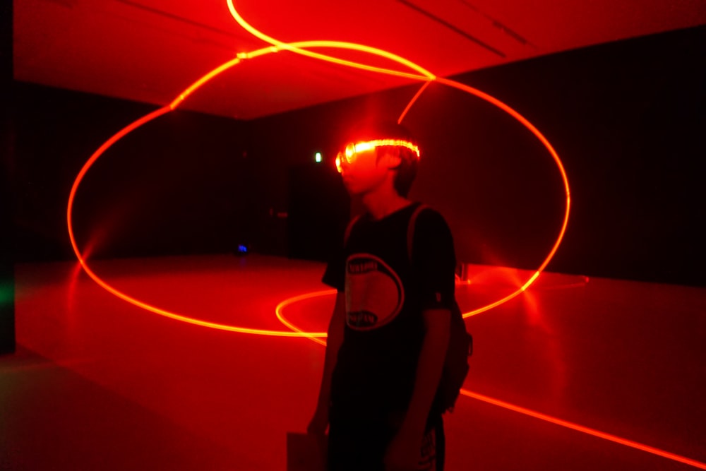 man wearing red neon eyeglasses