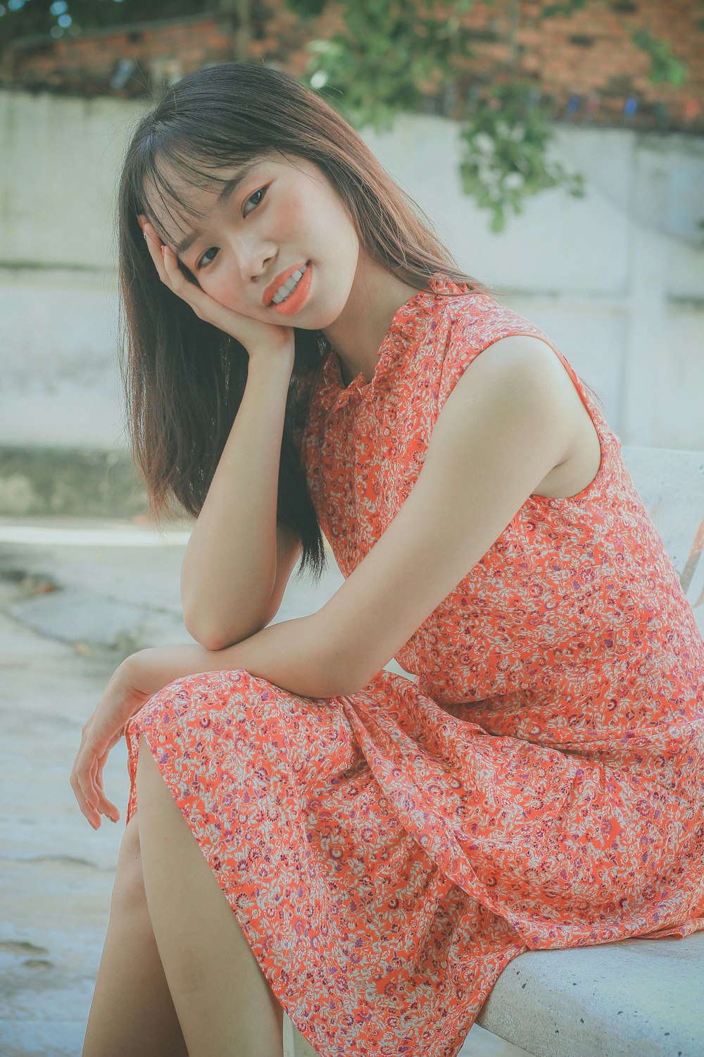 women's red and white floral mini dress close-up photography