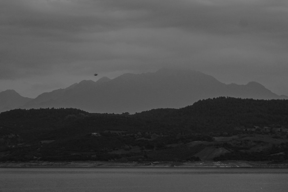 a black and white photo of a mountain range