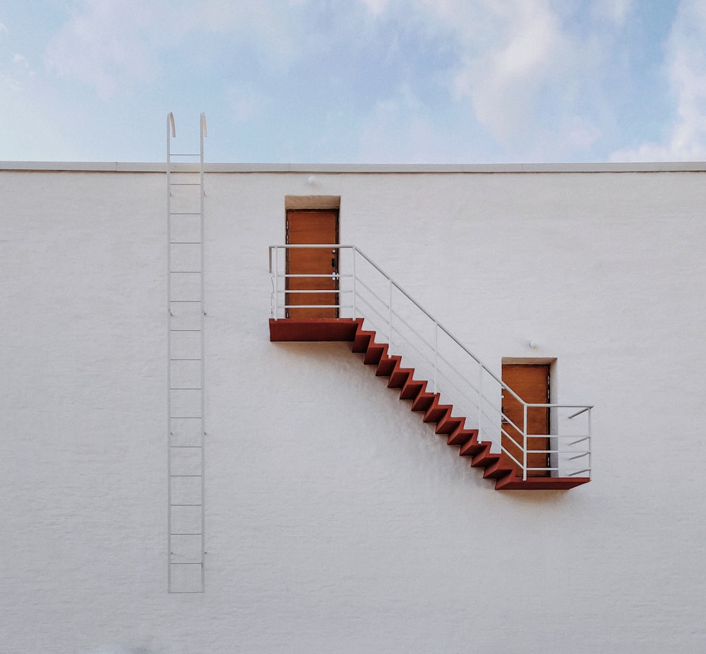 grey metal stairs at the side of the building