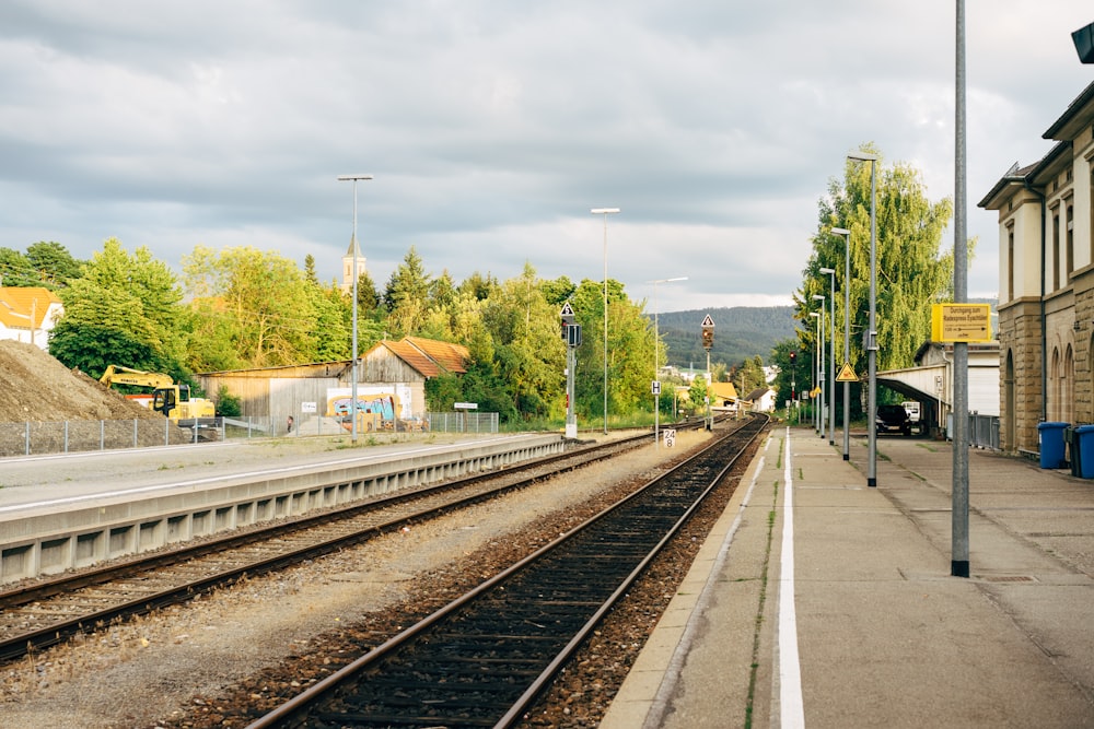 grey metal railway during daytime