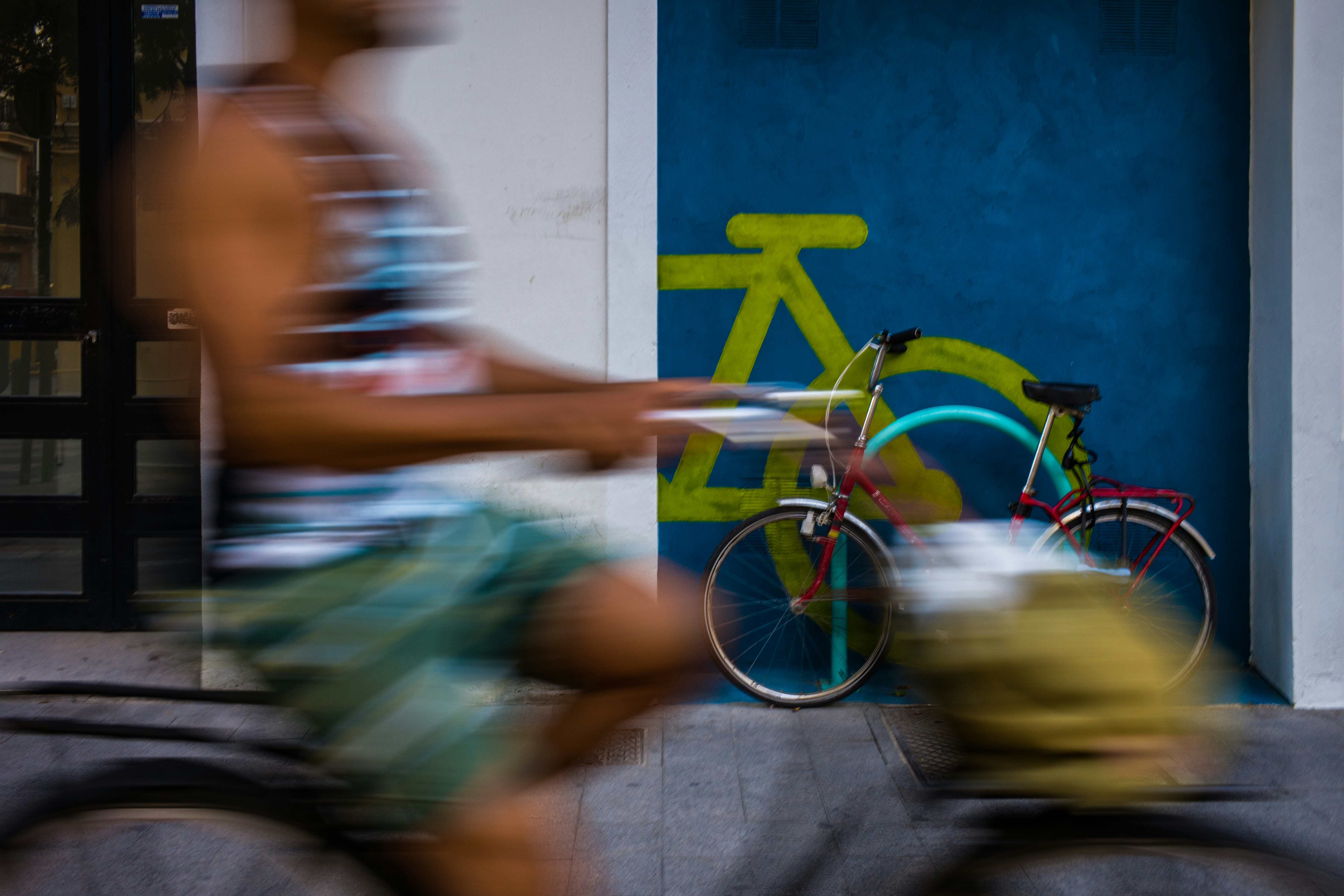 a blurry photo of a man riding a bike