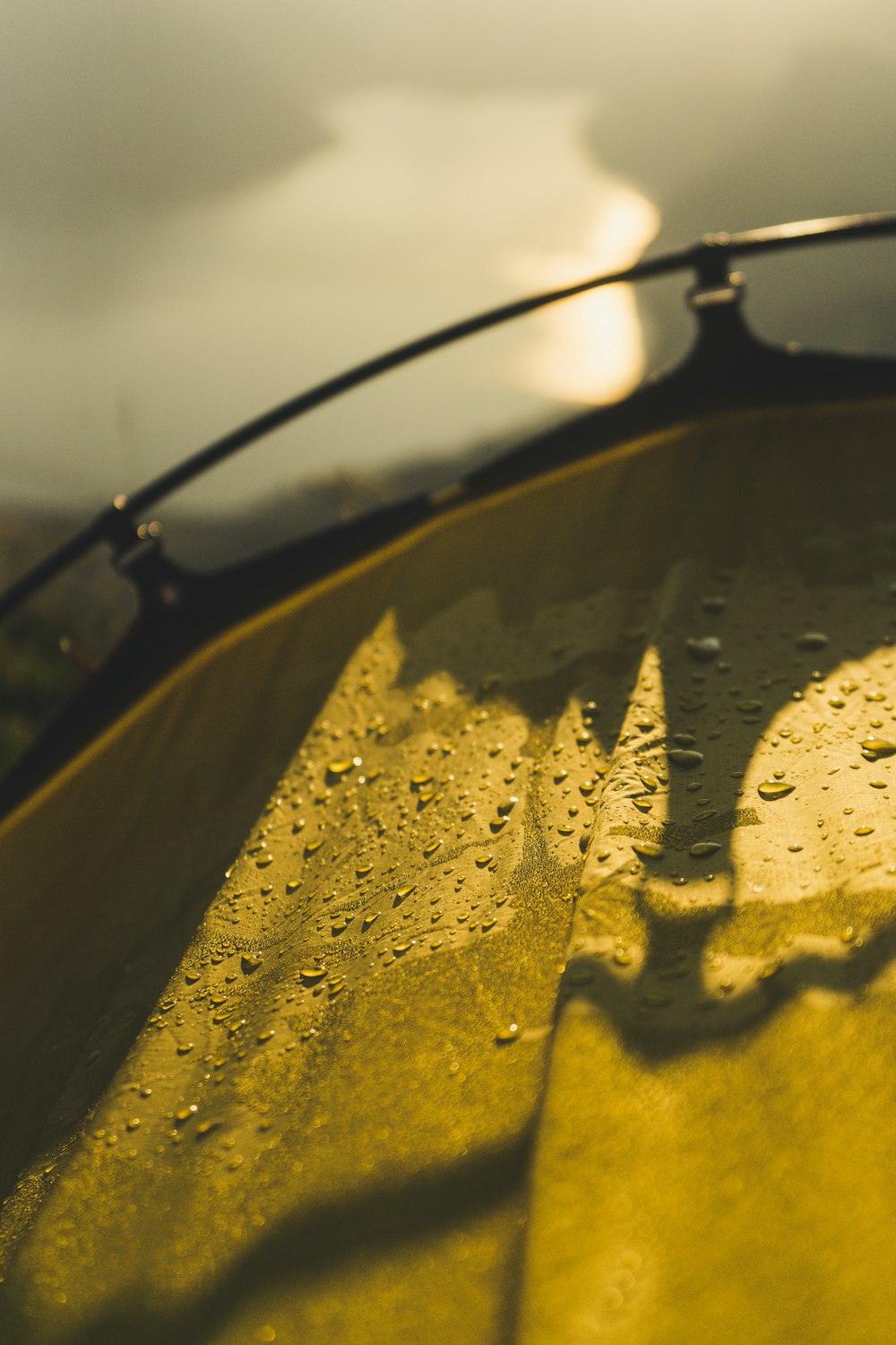 a yellow surfboard with water drops on it