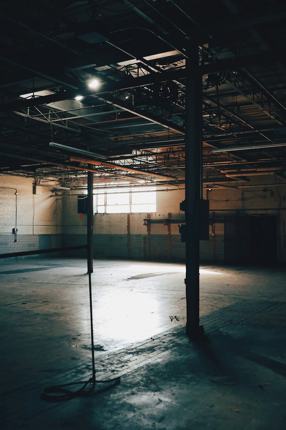 an empty parking garage with a parking meter