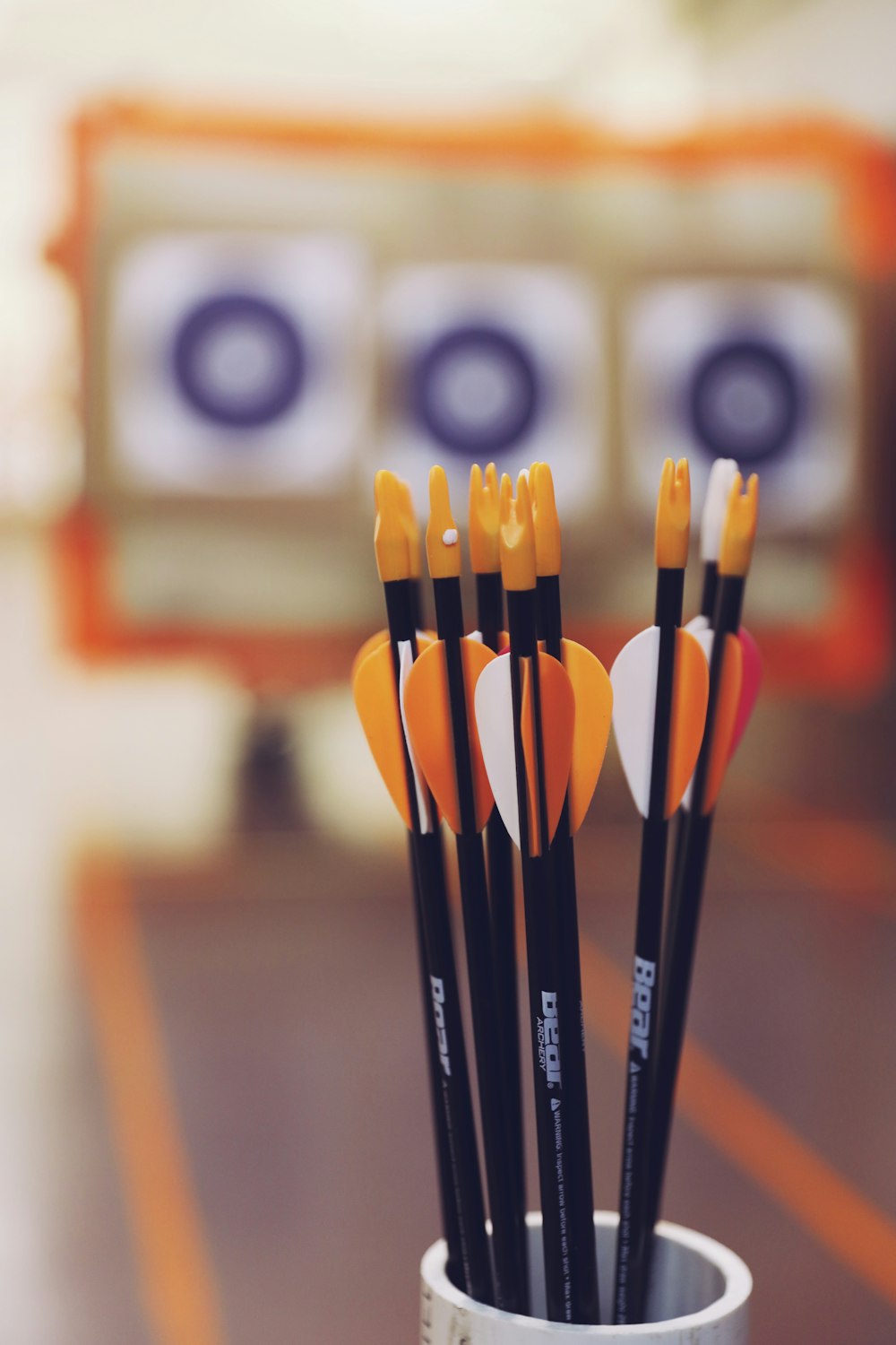 black and orange dart pins