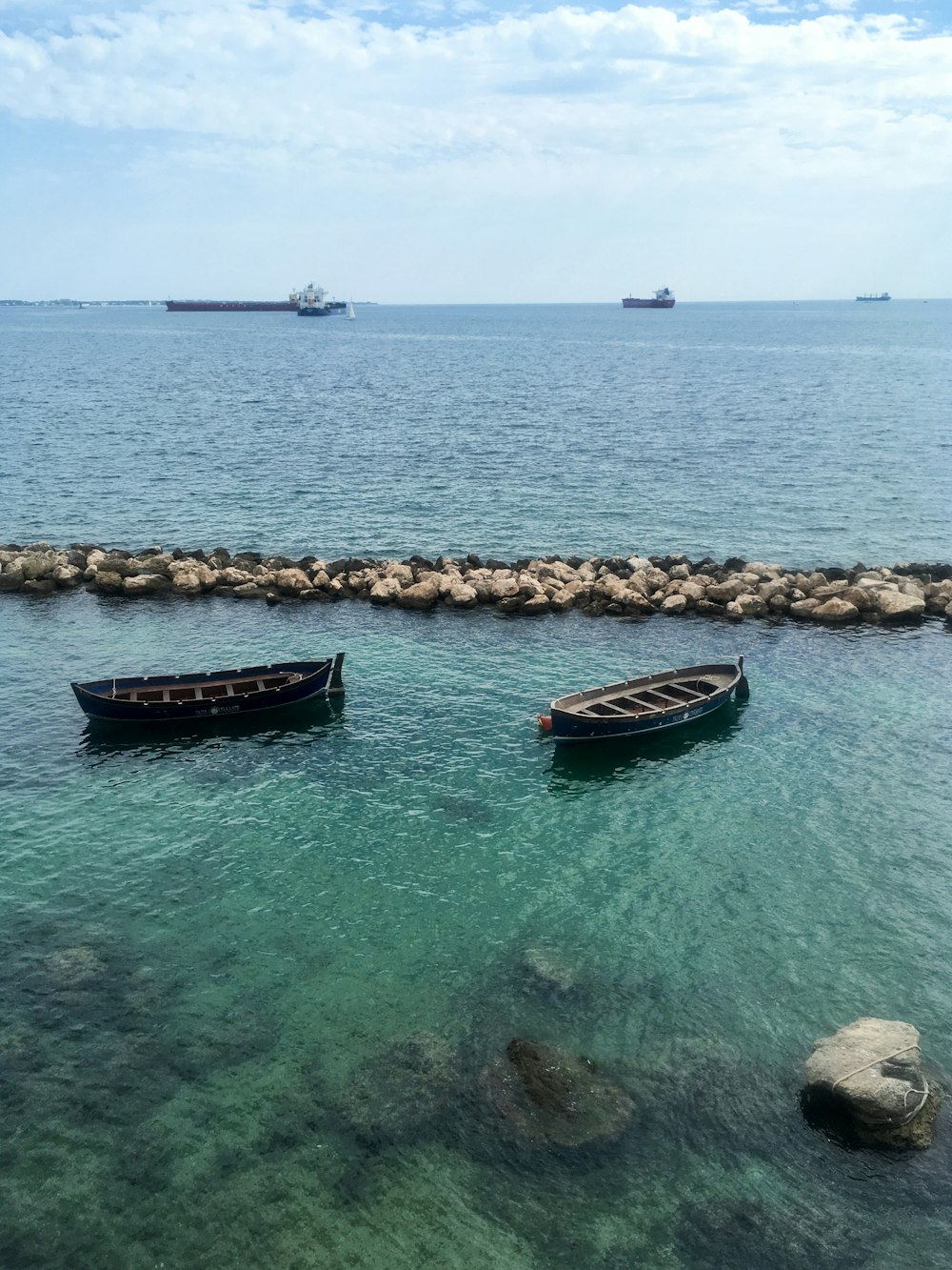 two brown canoe boats