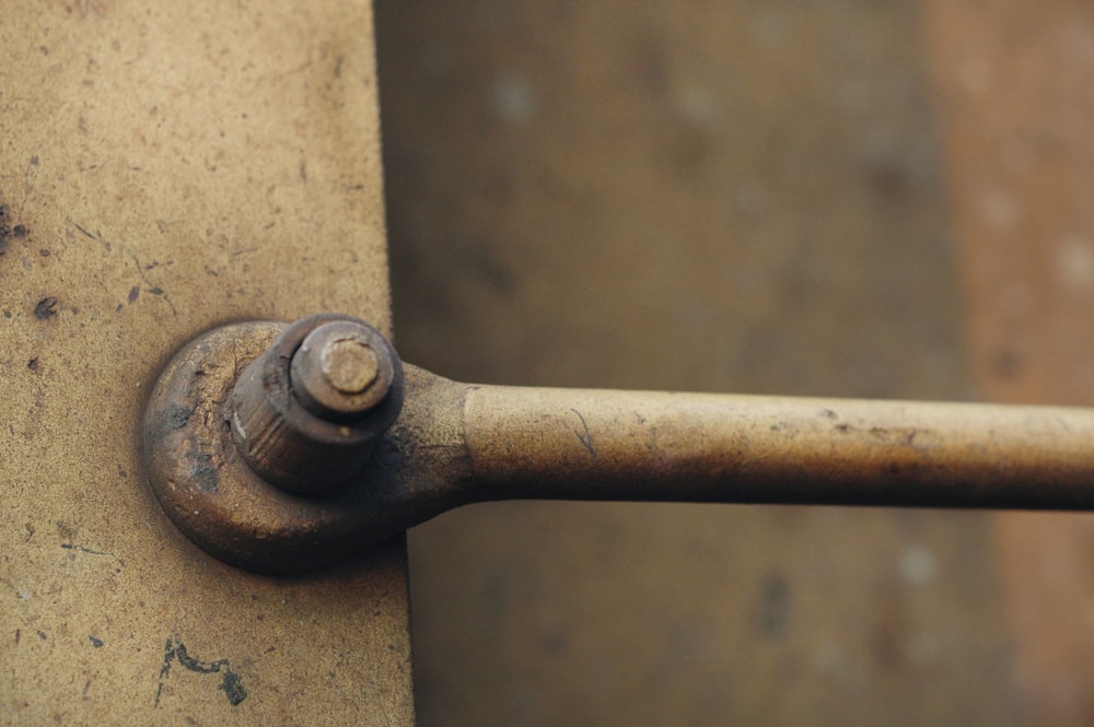 a rusted metal handle on a door