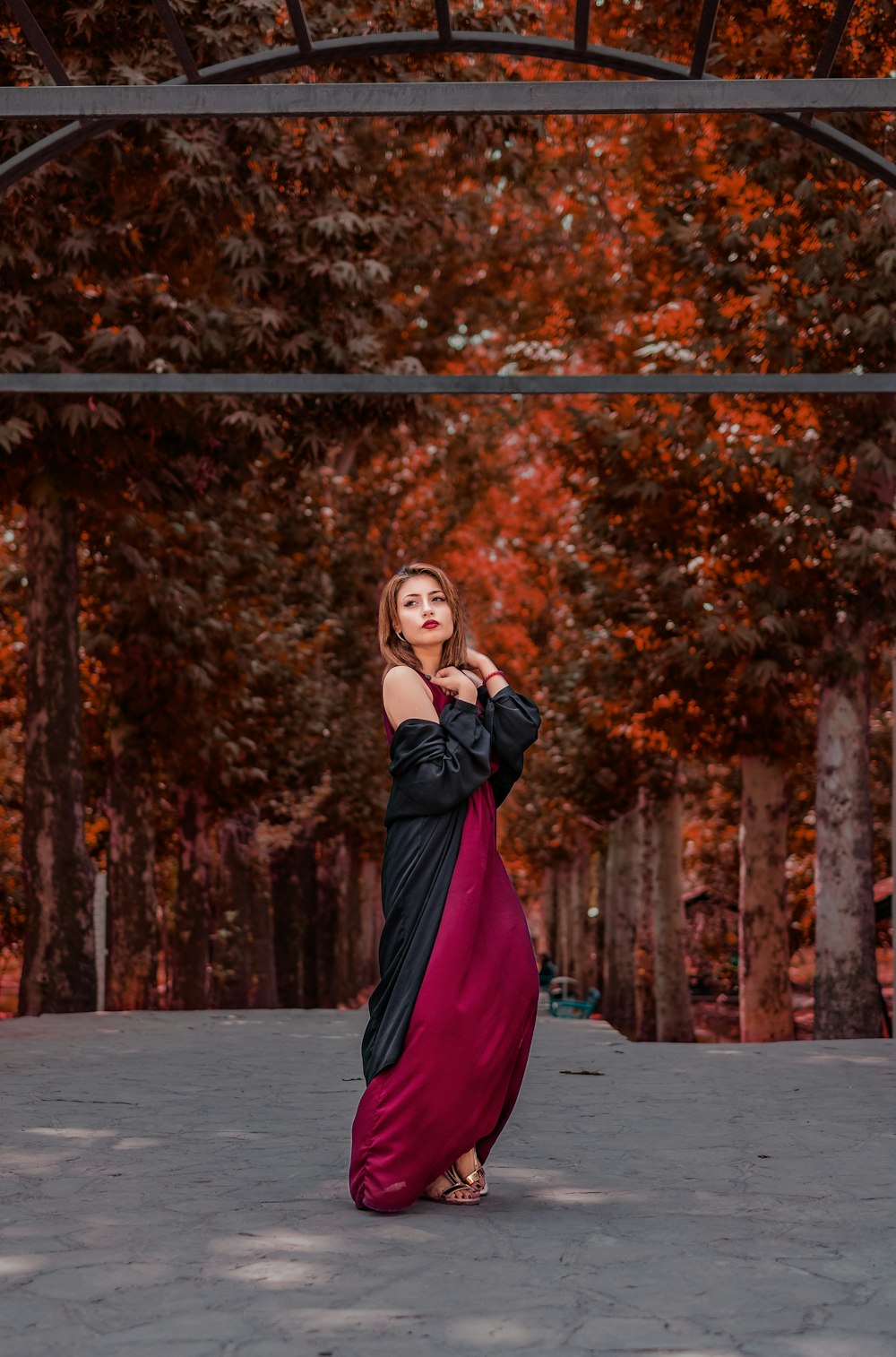 woman standing under metal frame