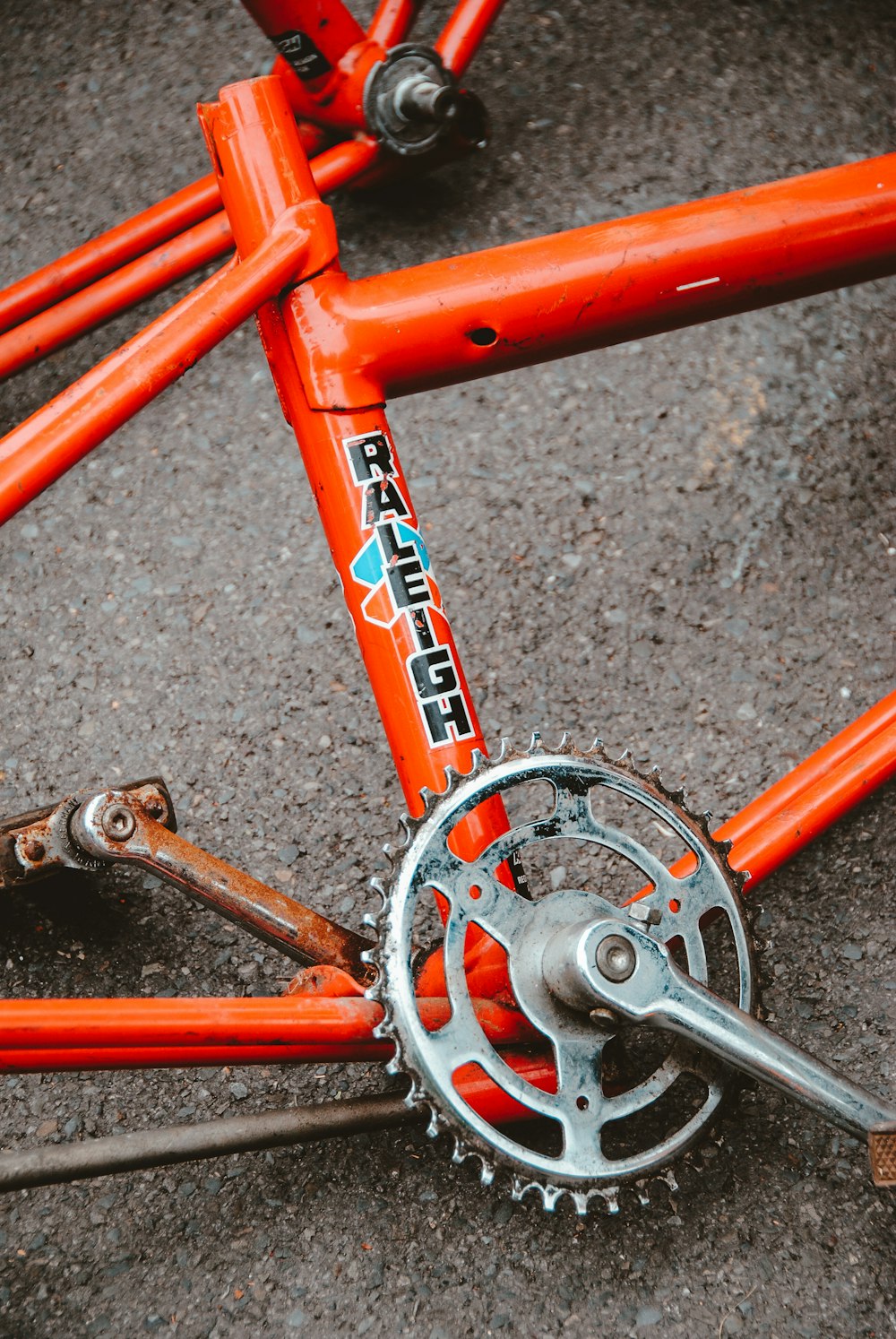 red and grey Raleigh bicycle