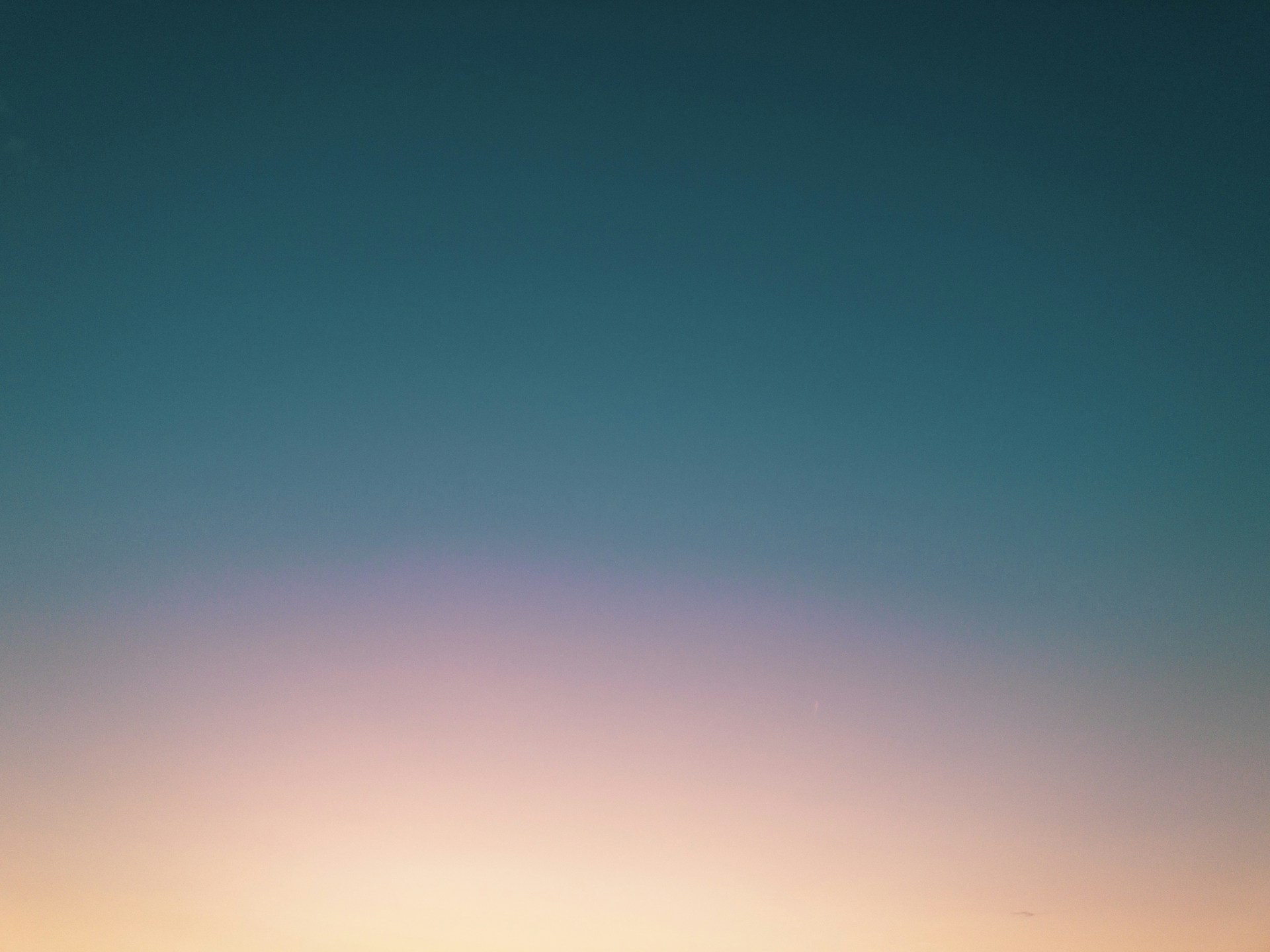 a couple of people standing on top of a beach