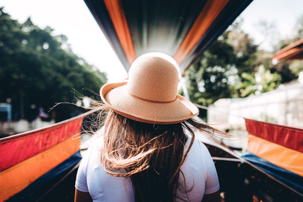 woman wearing beige hat