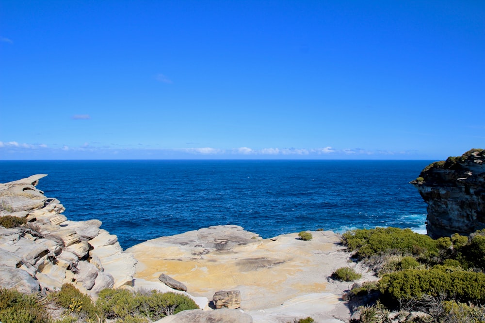 rocks near sea during daytime