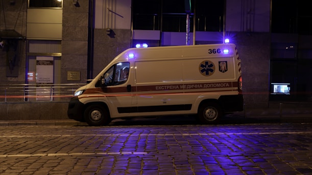 an ambulance is parked on the side of the street