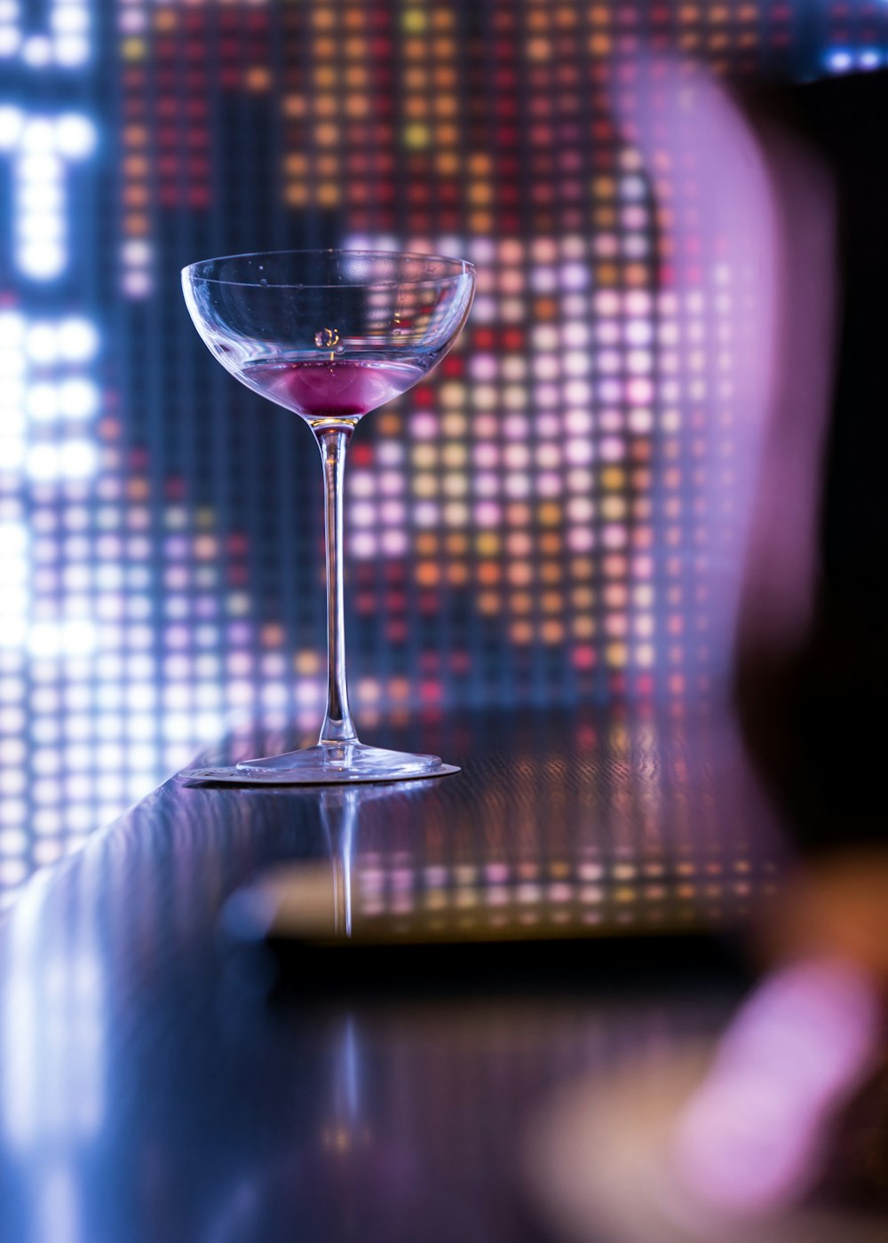 a close up of a wine glass on a table