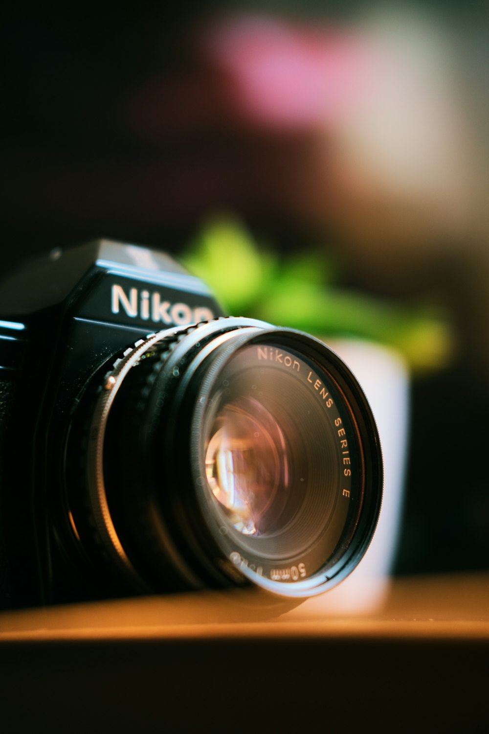Nikon camera on wooded board