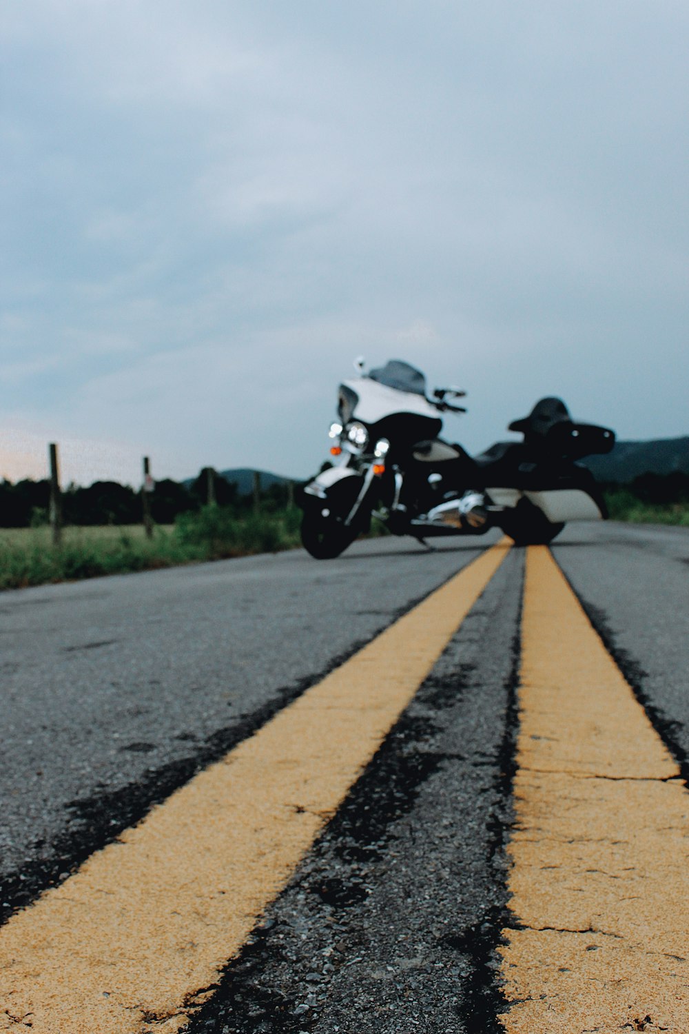 a motorcycle is parked on the side of the road